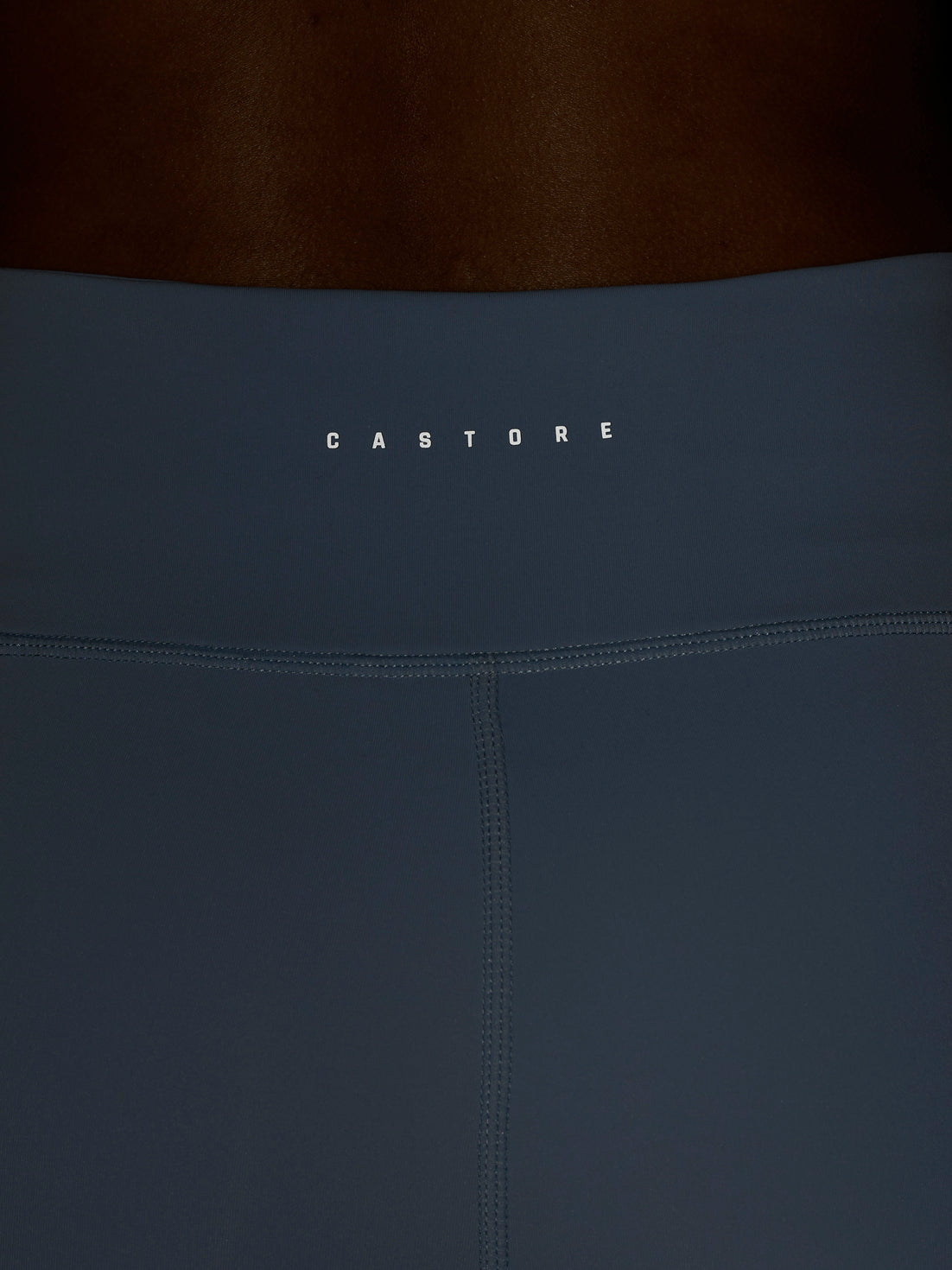 Back waist area of Zone Training Leggings with branding on the waistband.