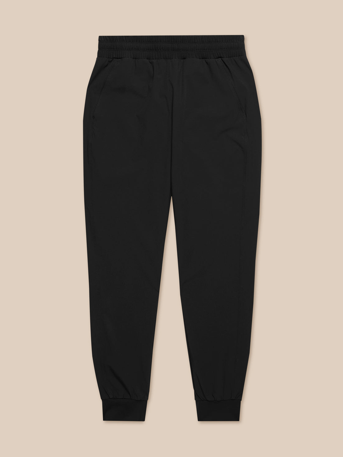 Flow Training Joggers in black front view with an elastic waistband and cuffed ankles