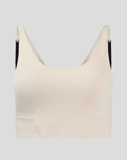 Beige Flow Training cropped sports bra with adjustable straps and removable cups.
