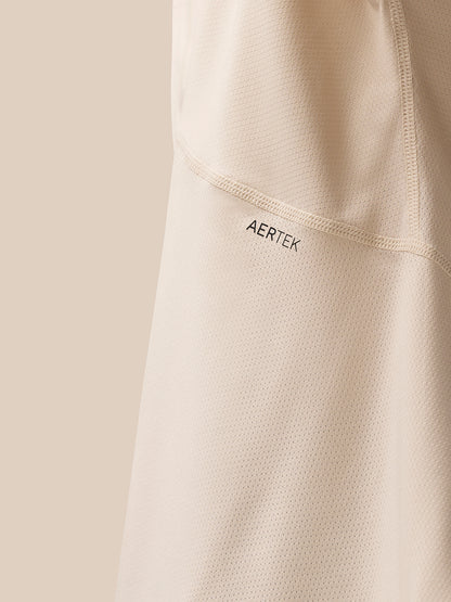 Close-up view of back area of beige Flow Training T Shirt showing AerTek branding and mesh texture.