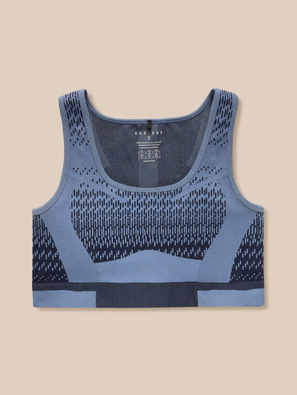 Front view of Flow Training Seamless Crop Sports Bra in Midnight Navy showing knit pattern on a flat background.