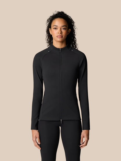 Back view of a woman in a black Zone Training Top full-zip jacket with a white logo on the upper back.