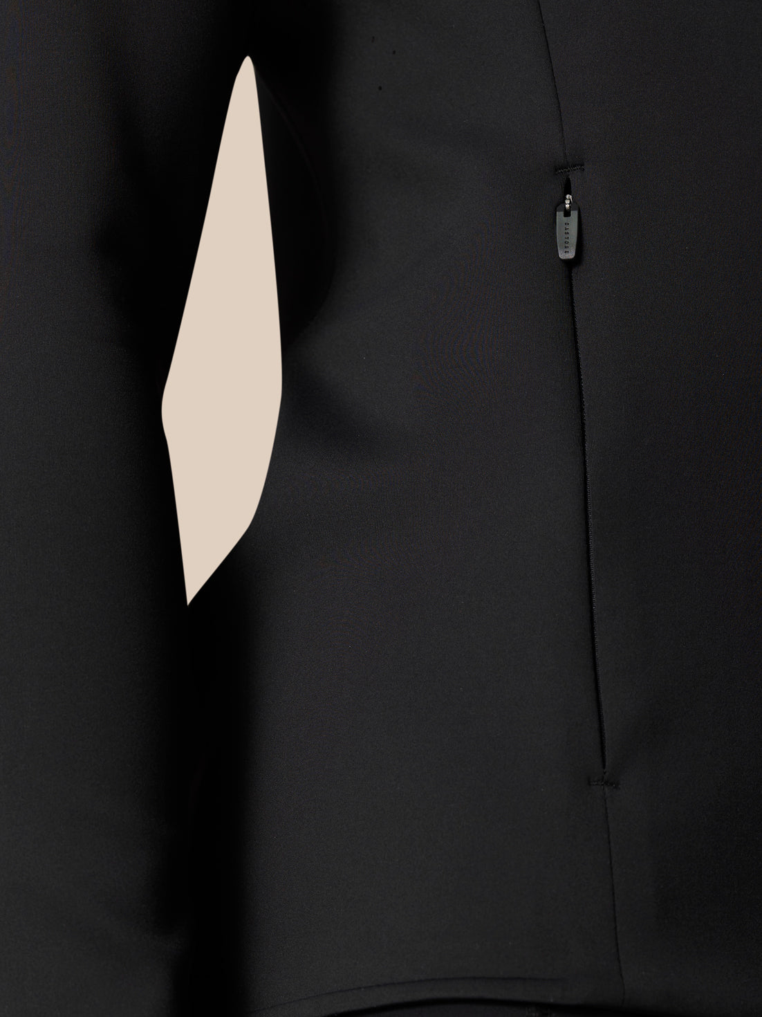 Close-up of black Zone Training Top highlighting a vertical zipper and seam panels.