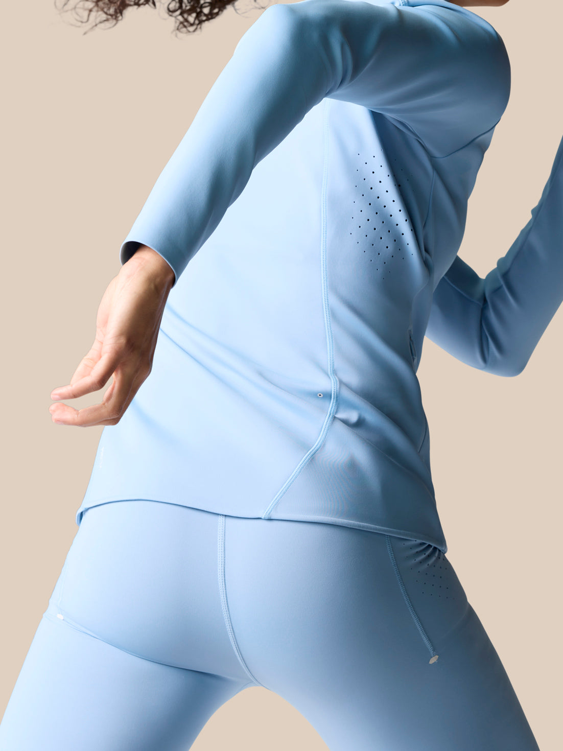 Back view of Zone Training Top sky blue with laser hole ventilation panel along the side