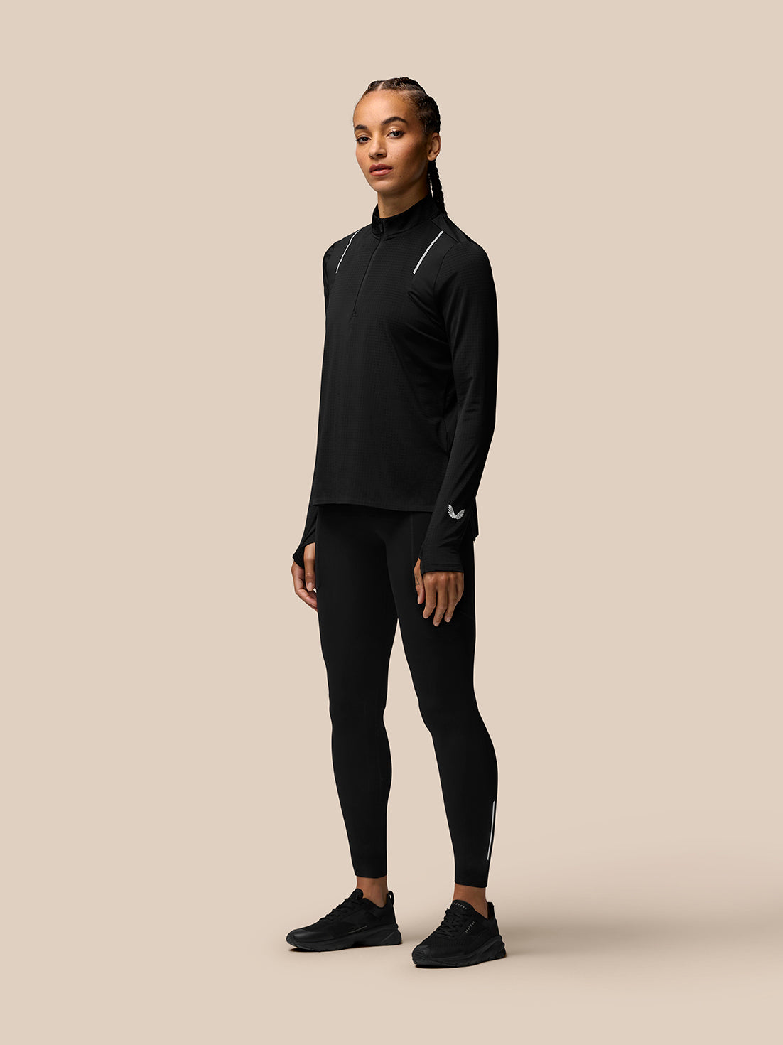 Back view of black Apex Training 1/4 Zip Top with vertical Castore branding along the upper back.