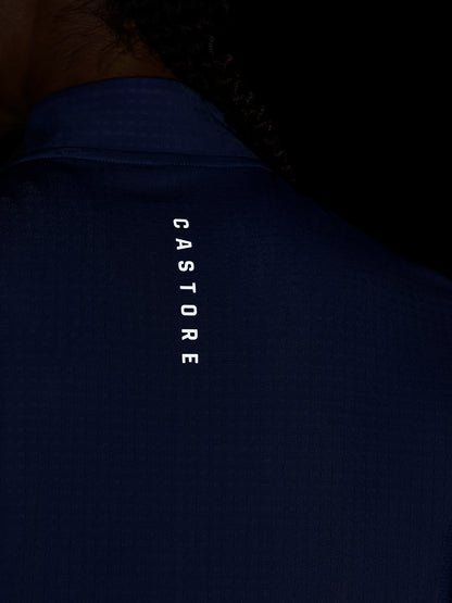 Back view of a dark blue Apex Training top with vertical Castore branding along the neck