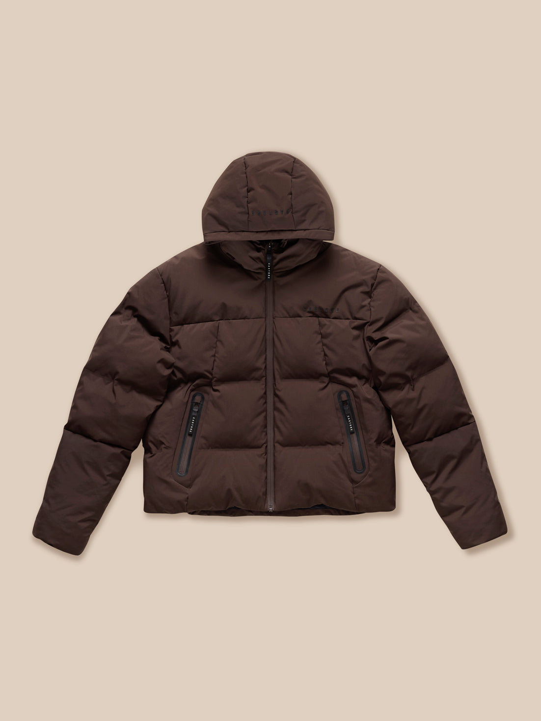 Rear view of brown Quilts Lifestyle Jacket with padded hood and Castore branding on the hood