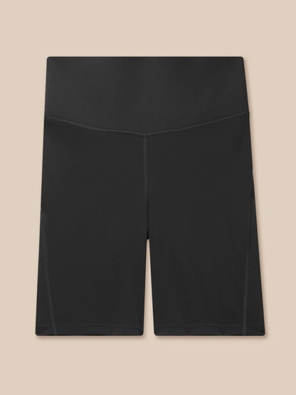 Back view of black Apex Training Cycle Shorts with a wide elastic waistband and stitched panels.