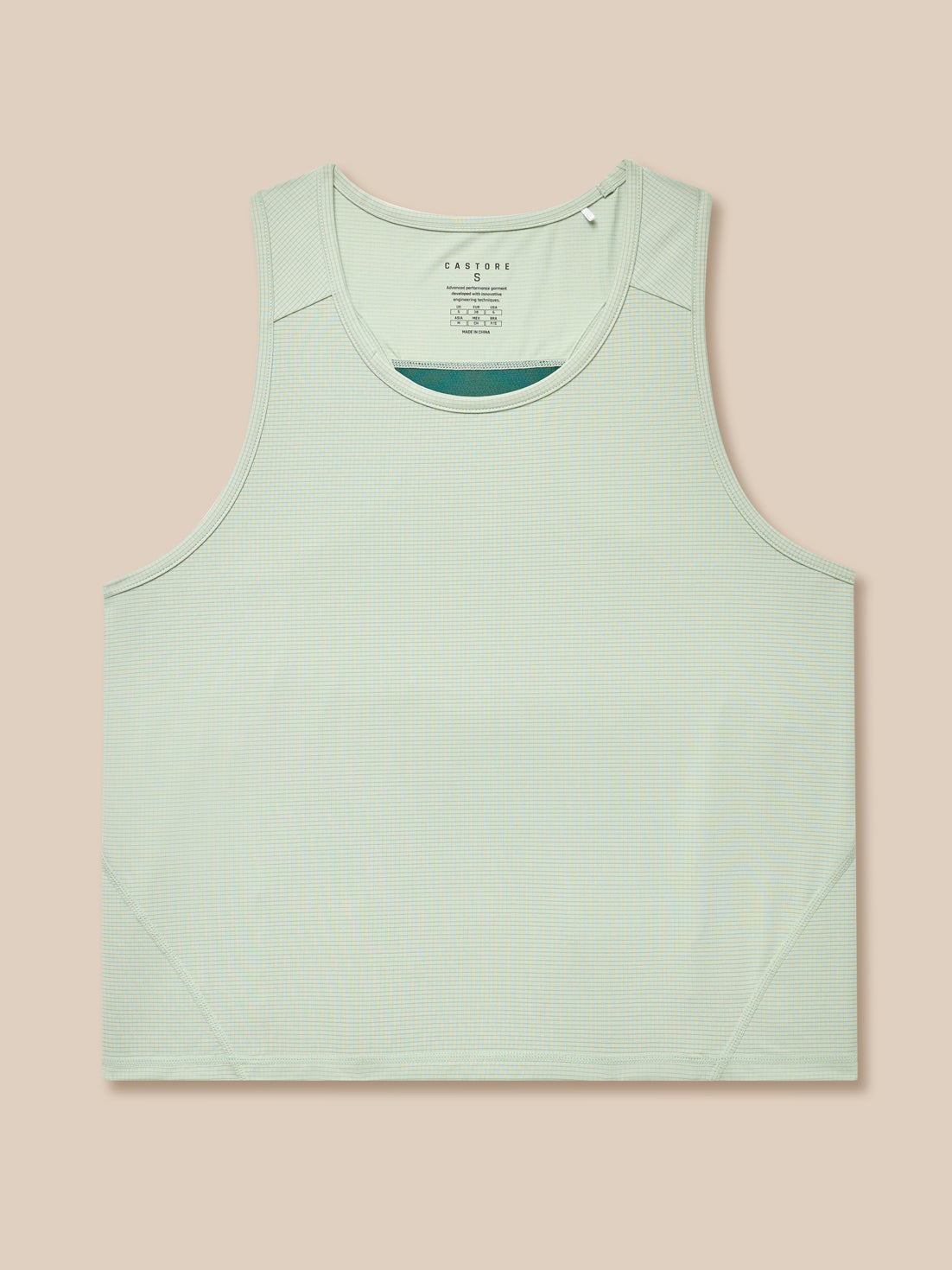 Close-up of sage Apex Training Tank Top laid flat showing fabric texture.