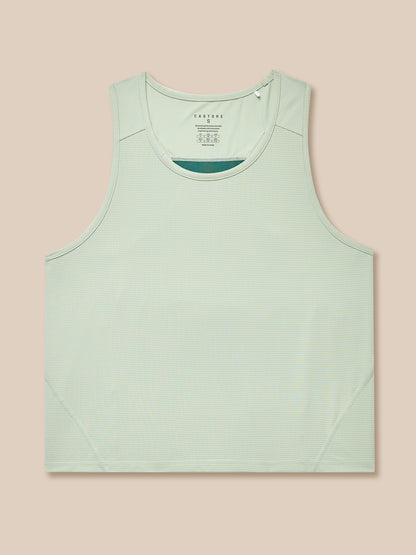 Close-up of sage Apex Training Tank Top laid flat showing fabric texture.