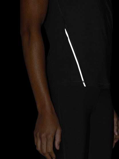 Close-up of black Apex Training T-Shirt side seam showing a white reflective stripe.