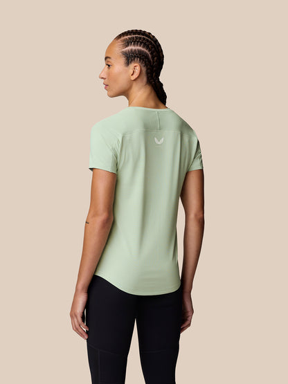Back view of model wearing Sage Apex Training T-Shirt with reflective logo on the upper back