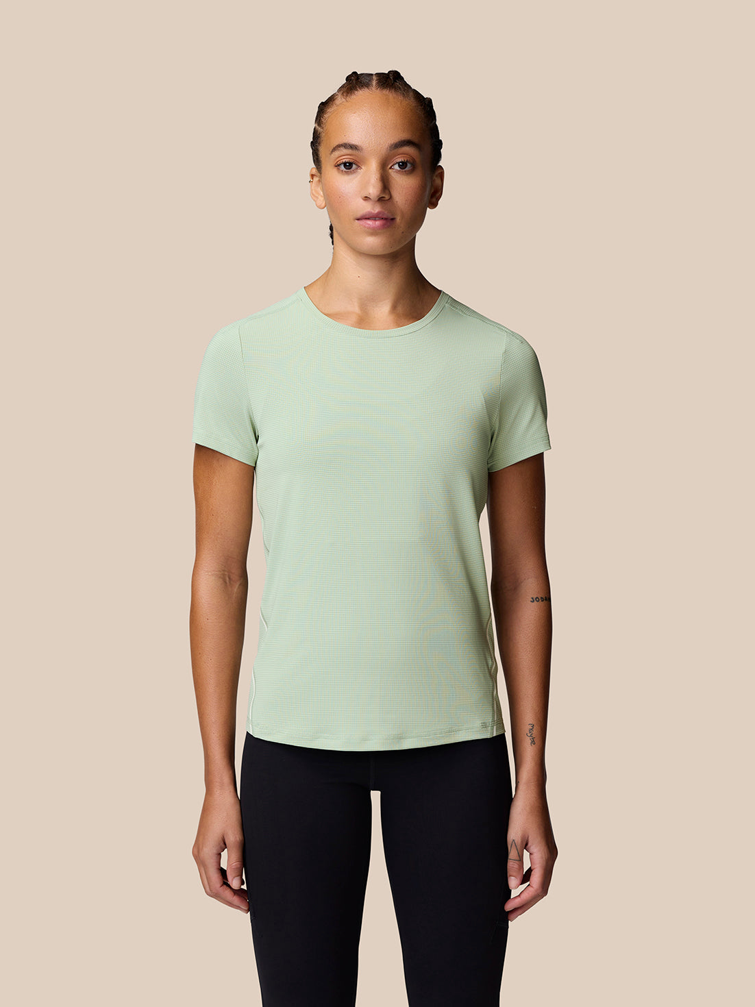 Front view of model wearing Sage Apex Training T-Shirt showing soft stretchy fabric