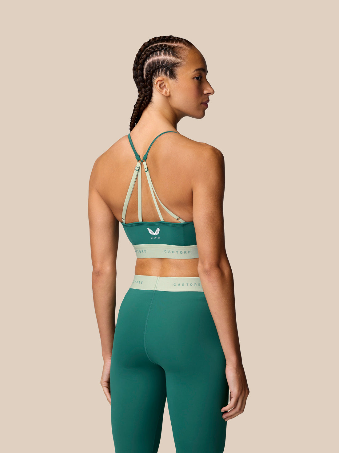 Back view of seafoam Adapt Training Sports Bra with multiple light straps forming a crisscross pattern and pale band.