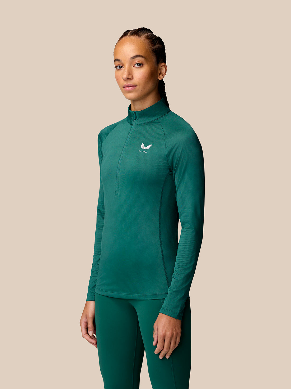 Model in seafoam Adapt Training half zip top with standing collar and long sleeves