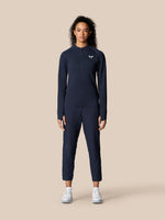 Woman wearing Midnight Navy Golf Pinnacle LVS ½ Zip Top with long sleeves and front half zip.