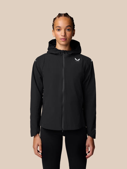 Front view of a woman wearing a black Apex Training Wind Jacket with hood and full front zipper