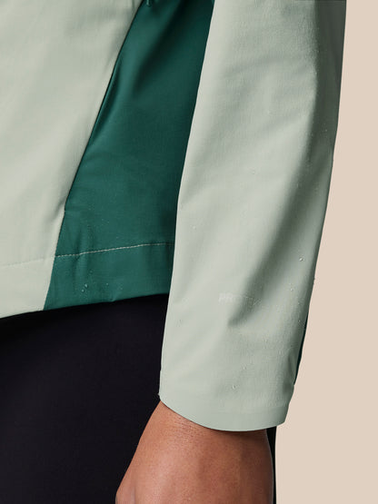 Close-up of Sage wind jacket sleeve with two-tone panels and ProTek marking.