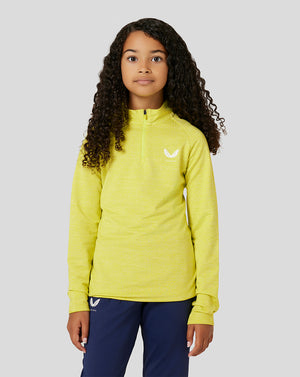 Child model wearing bright lime Citrus Junior Standard 1/4 Zip with a small white logo on the chest