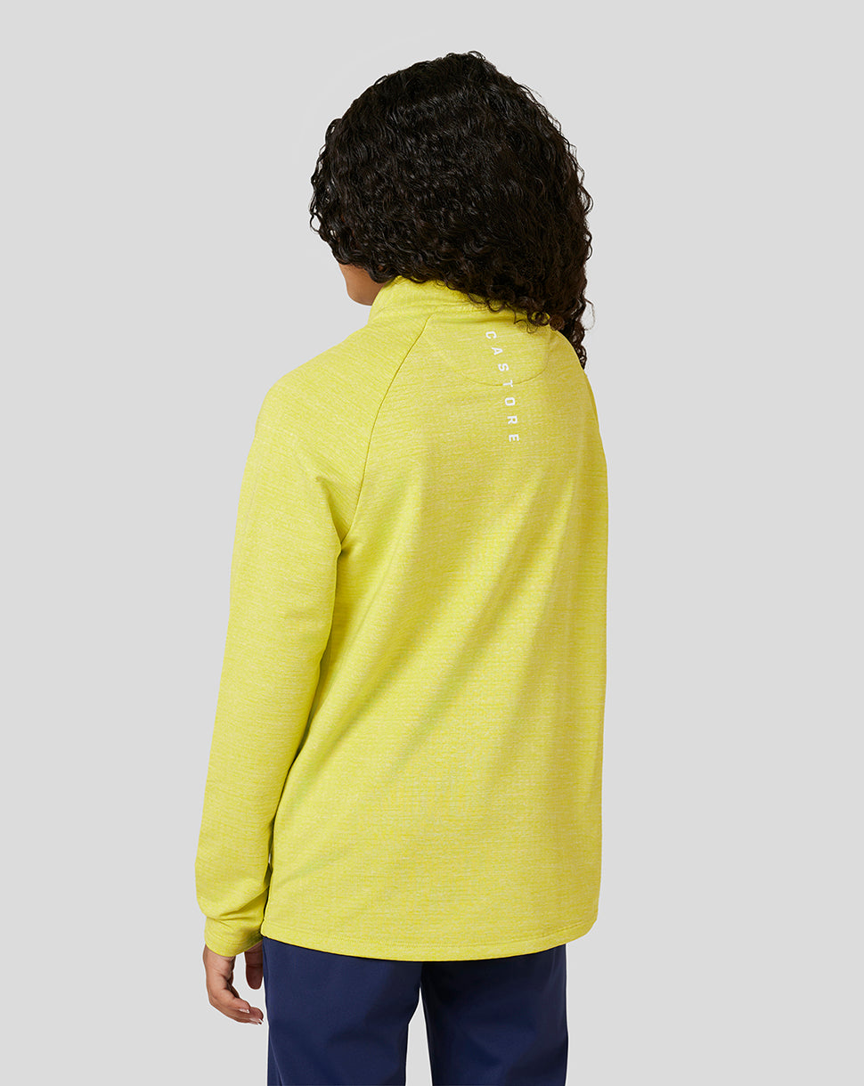 Back view of a child in lime Citrus Junior Standard 1/4 Zip showing a white logo on the upper back