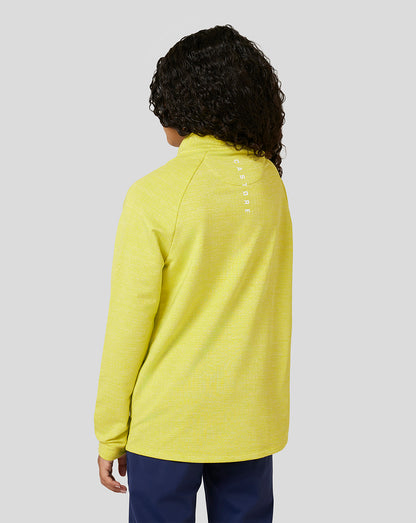 Back view of a child in lime Citrus Junior Standard 1/4 Zip showing a white logo on the upper back