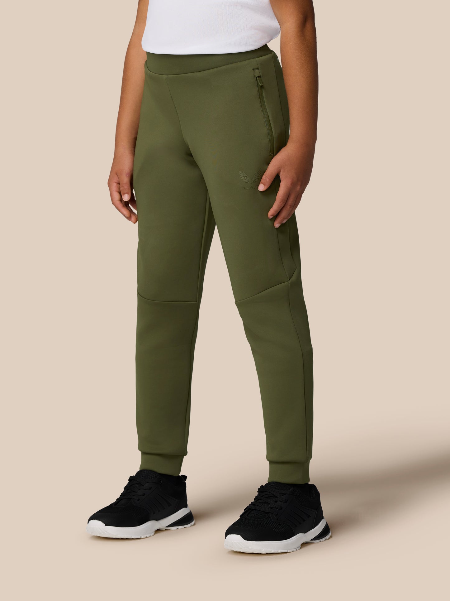 Model wearing olive green Junior's Flex Scuba Trousers with logo on the left leg and tapered cuffs