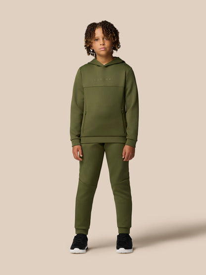 Child model wearing olive green hooded Flex Scuba tracksuit with matching pants and Castore logo on the chest
