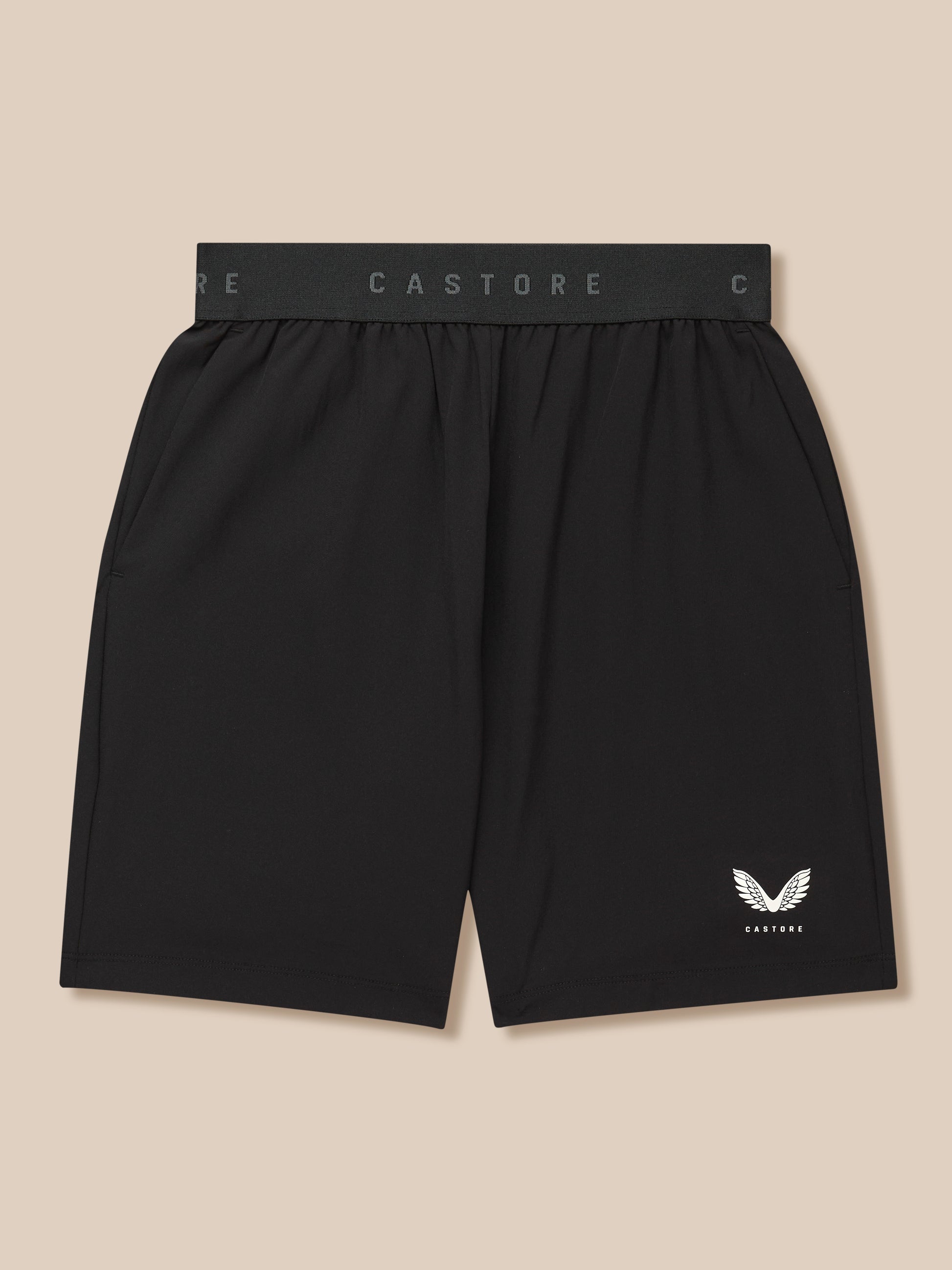 Junior's Adapt Woven Shorts in black with Castore branded waistband and wing logo on the lower right leg.