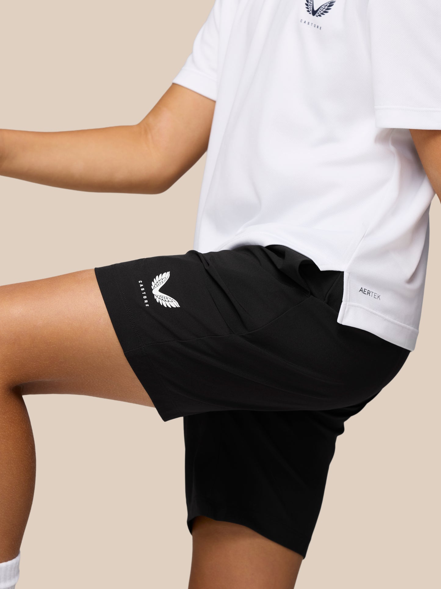 Back view of black ProTek shorts with elastic waistband and Castore logo at the left thigh.