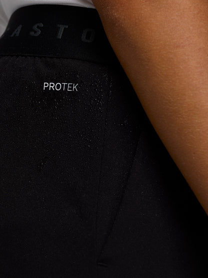 Close up of black shorts with Castore logo and wing emblem on the left thigh.