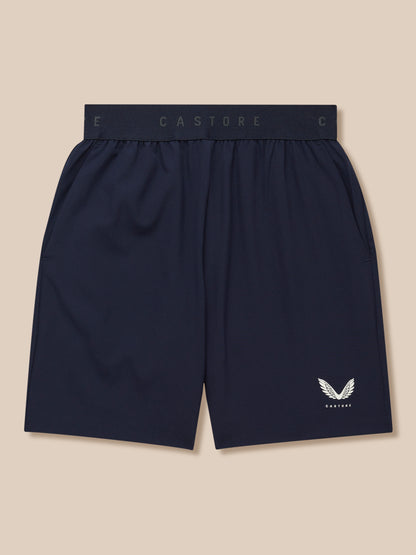 Navy Junior Adapt Woven Shorts with elastic waistband and Castore branding, white wing logo on the leg.