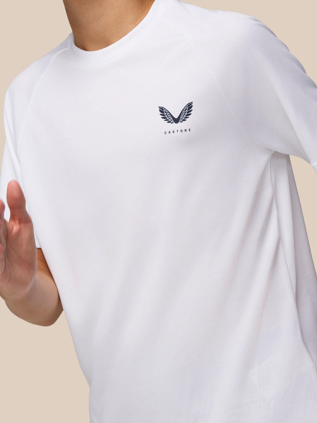 Front view of the white Junior Adapt Training T Shirt showing Castore logo on the left chest