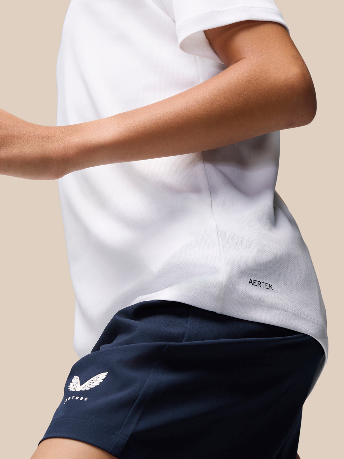 White Junior Adapt Training T Shirt with Castore logo on left chest and AerTek branding along the side