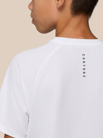 Back view of the white Junior Adapt Training T Shirt with vertical Castore branding along the upper back