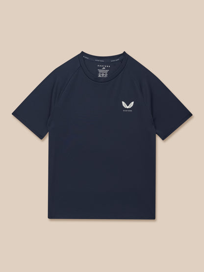 Navy Junior Adapt short sleeve T shirt laid flat with white Castore logo on chest