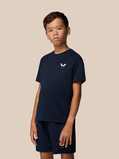 Navy Junior Adapt Short Sleeve T Shirt with Castore logo on left chest paired with navy shorts