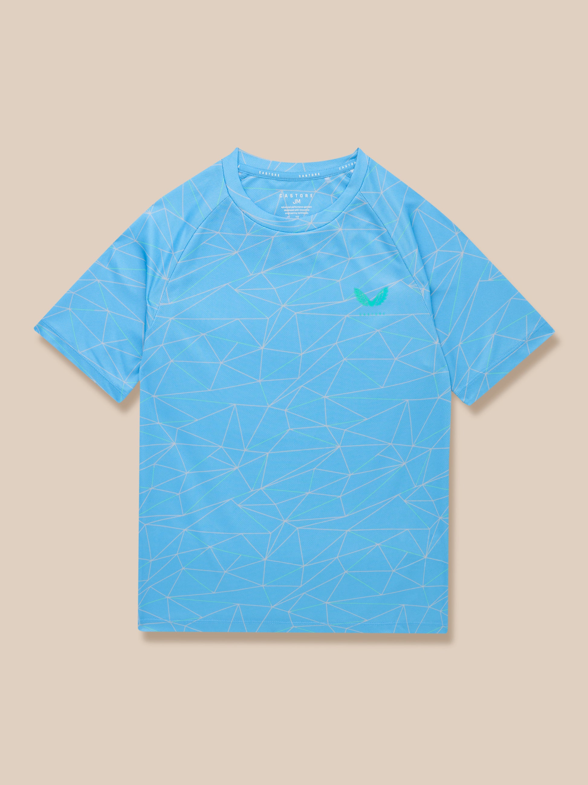 Junior blue allover print short sleeve T shirt with a green Castore logo on the chest.