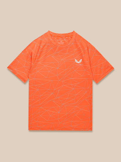 Bright orange Junior Adapt all over print short sleeve T shirt with geometric line pattern and Castore logo on left chest.