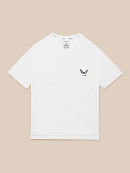 White junior Adapt short sleeve T shirt with reflective Castore logo on left chest.