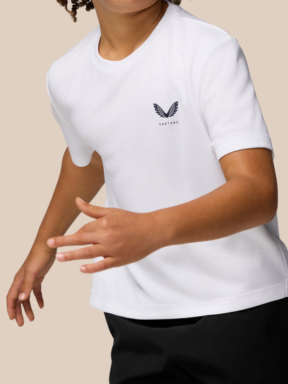 Junior white Castore Adapt short sleeve T shirt with reflective logo on the left chest