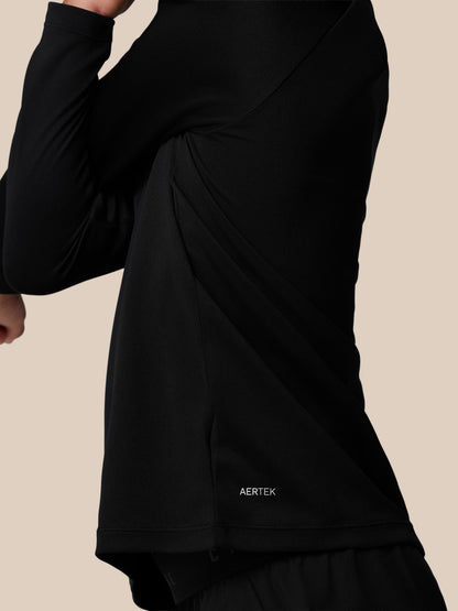 Back view of the black Adapt lightweight quarter zip showing branded back neck tape and collar details.