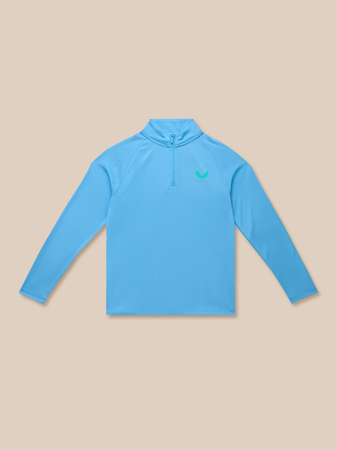 Light blue junior training quarter-zip top with stand collar and green Castore logo on left chest.
