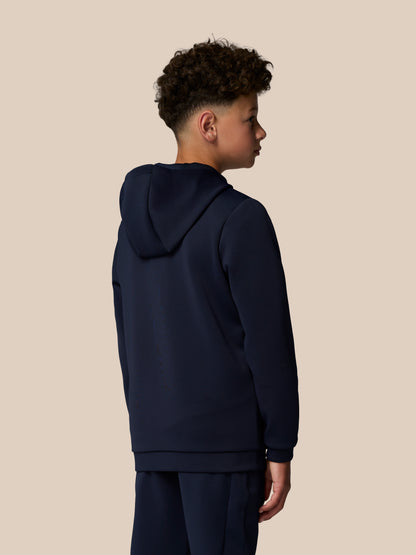 Back and side view of a navy Junior’s Flex Scuba Long Sleeve Hoodie on a young model with hood down