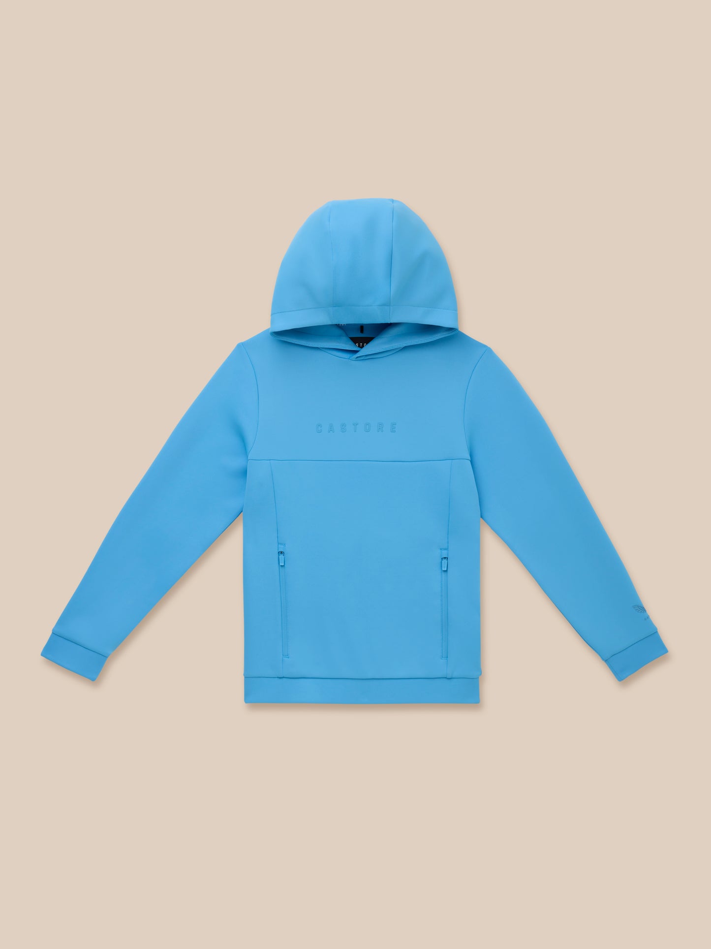 Cool blue Junior’s Flex Scuba hoodie with hood up laid flat on a beige background