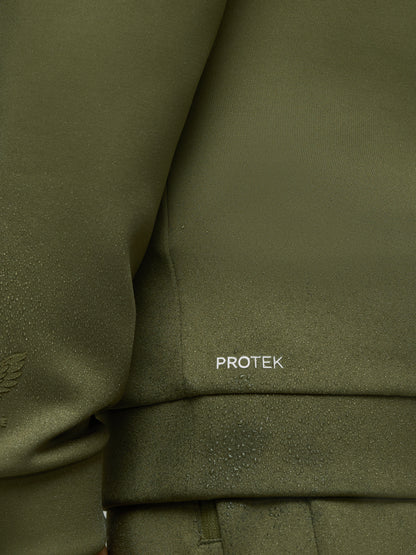 Close-up of olive green scuba fabric with water droplets and PROTEK logo on sleeve
