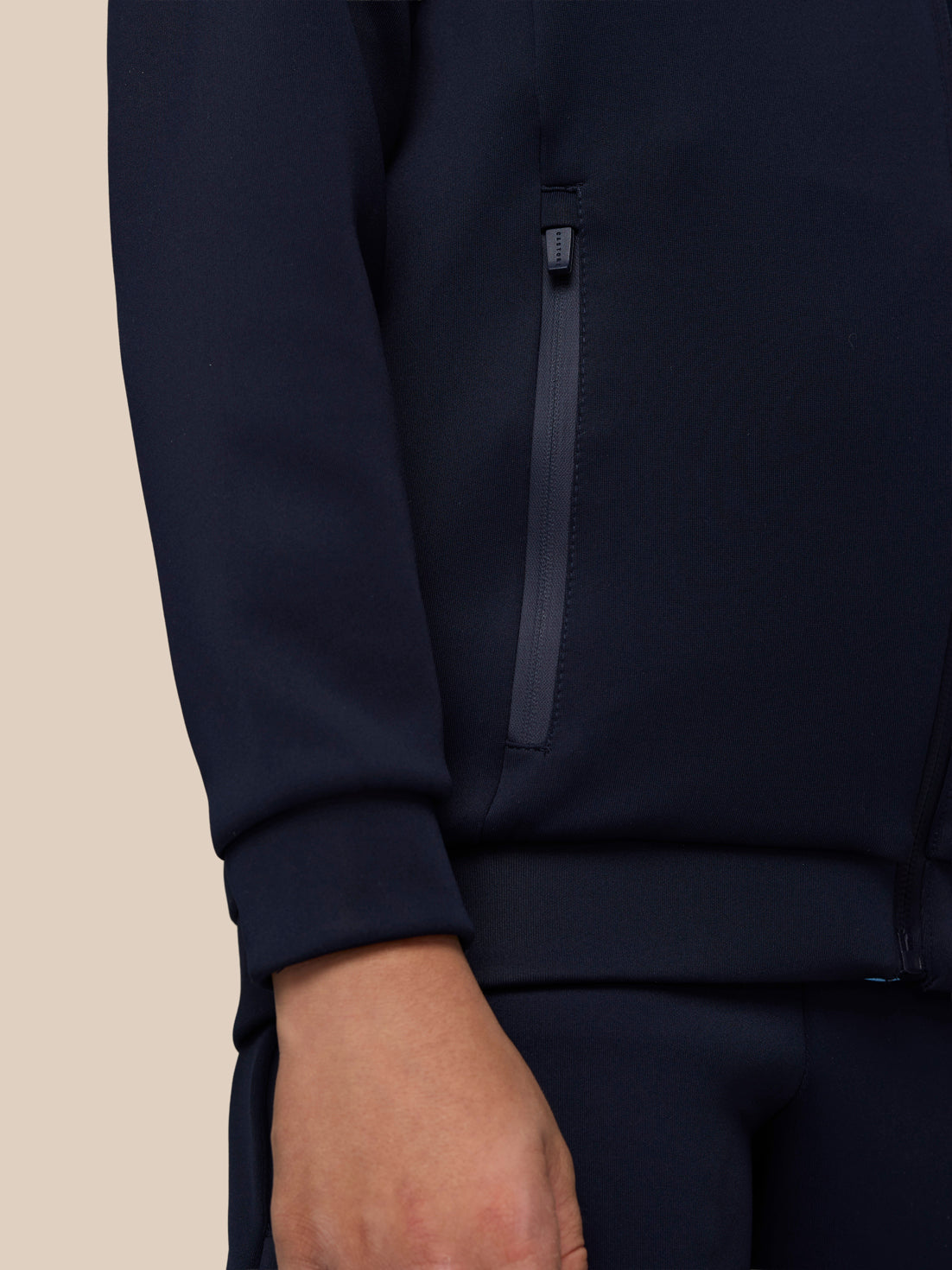 Navy Junior’s Flex Scuba jacket side view showing a vertical zip pocket