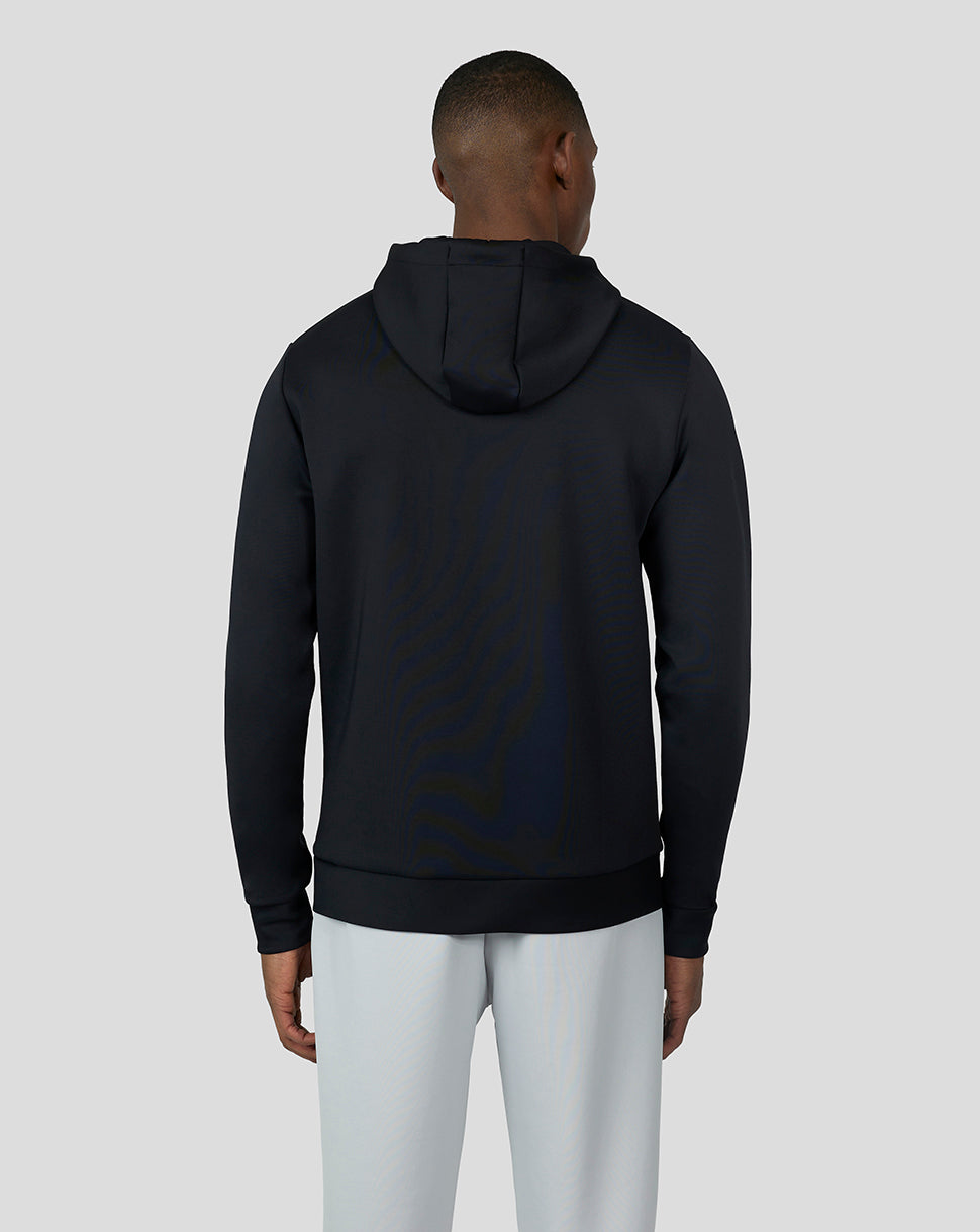 Back view of a model in a black Flex Hoodie 3.0 with hooded neckline and ribbed hem