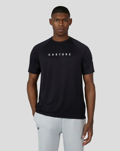 Male model in black short sleeve raglan tee with white Castore branding on chest and raglan sleeves