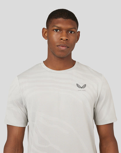 Front view of Oyster white Core Tech T Shirt with subtle pattern and Castore logo on left chest.