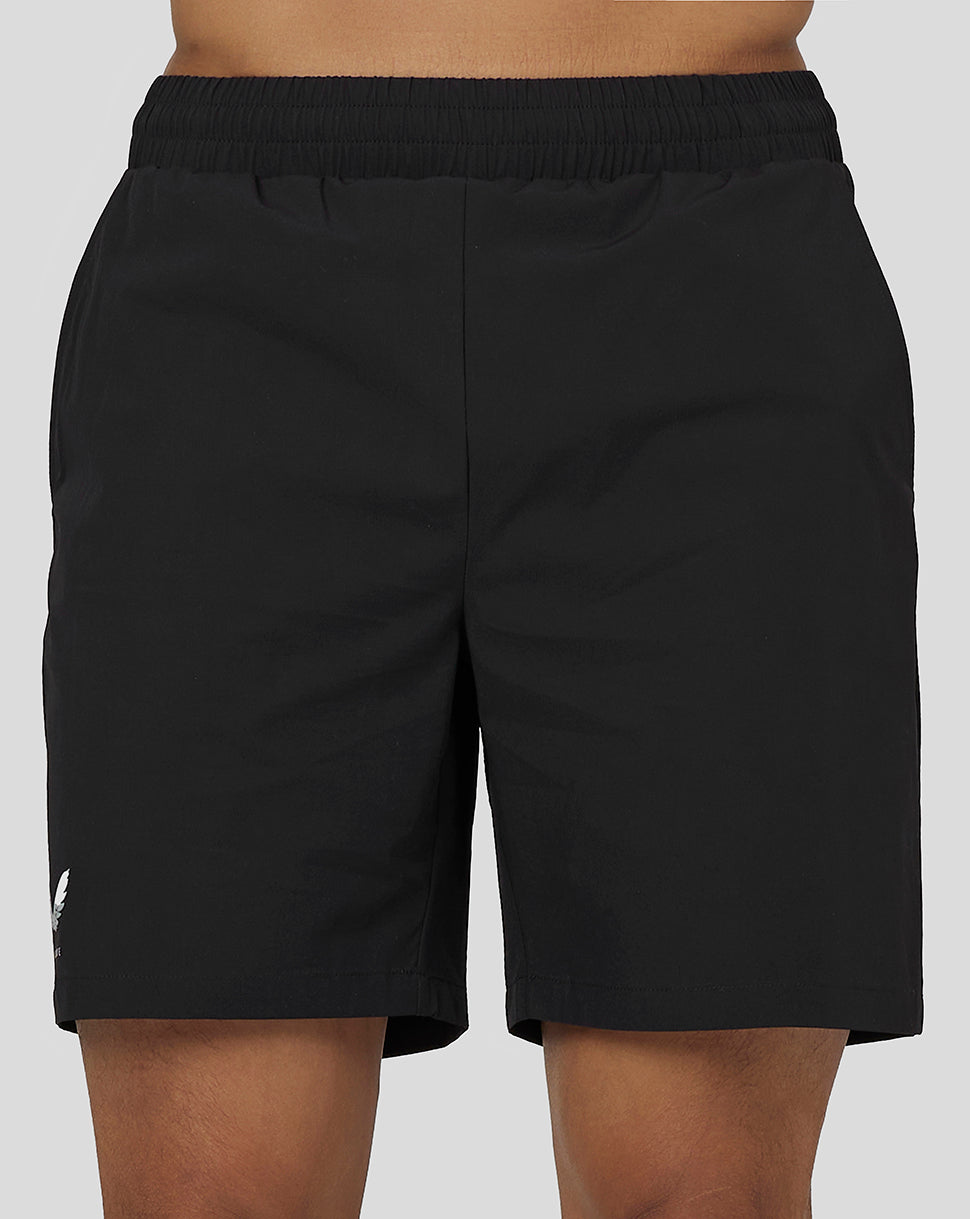 Close-up of black active woven shorts with an elastic waistband and Castore branding on the leg.